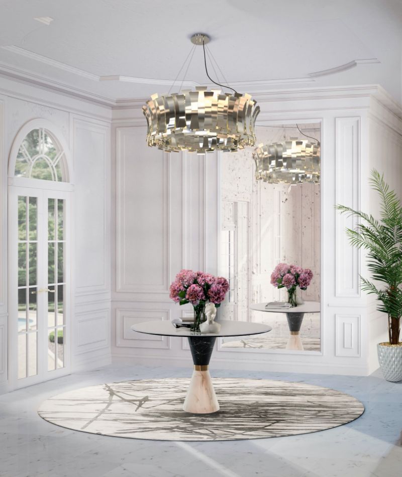 The Best Modern Rugs For Your Living Room & Hallway Modern Classic Hallway with a round white and brown rug. The room's focal point is the rug with ths small table with a marble pattern. The chandelier gives it a touch of fineness and refinement.