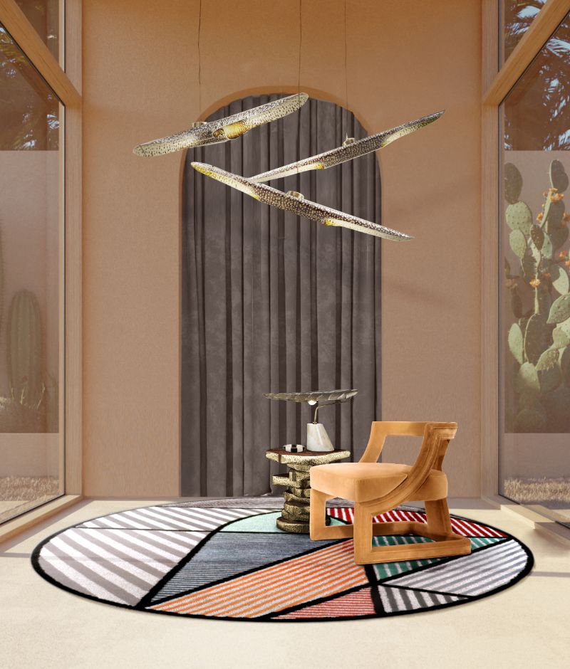 Modern midcentury living room corner with geometric round LOLA RUG with a colorful pattern and straight lines. Transform this living area into a colorful space with the round rug and suspension lights and orange armchair. New RUG'SOCIETY Catalogue 2022 With Exclusive Rugs