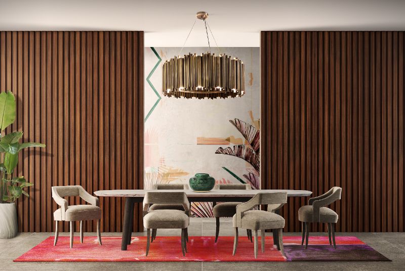 Modern mid-century dining room with warm tones. The Toulousse Rug brings a cozy feeling to the room and pairs well with the velvet armchairs and dining room.