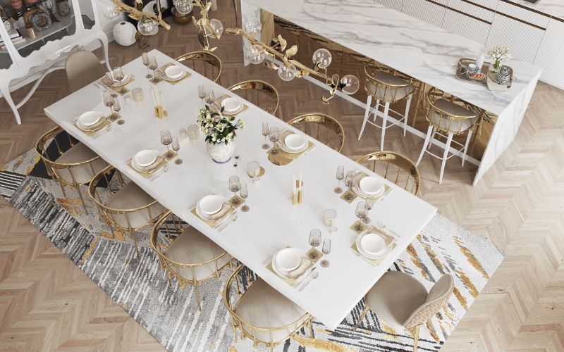 Xisto rug in luxurious dining room with white rectangular table and golden chairs