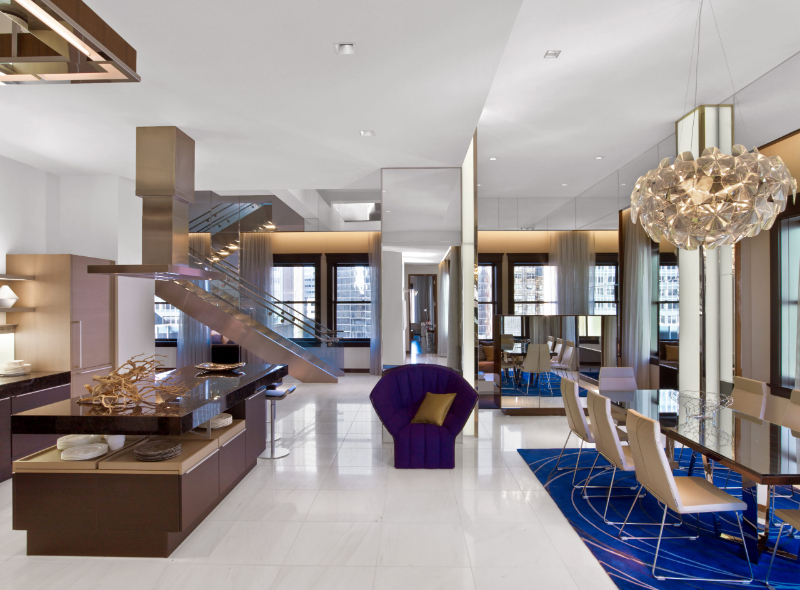 Forrest Perkins: Contemporary Rugs In Hospitality Projects.  Dining area of the hotel with a vibrant blue rug.