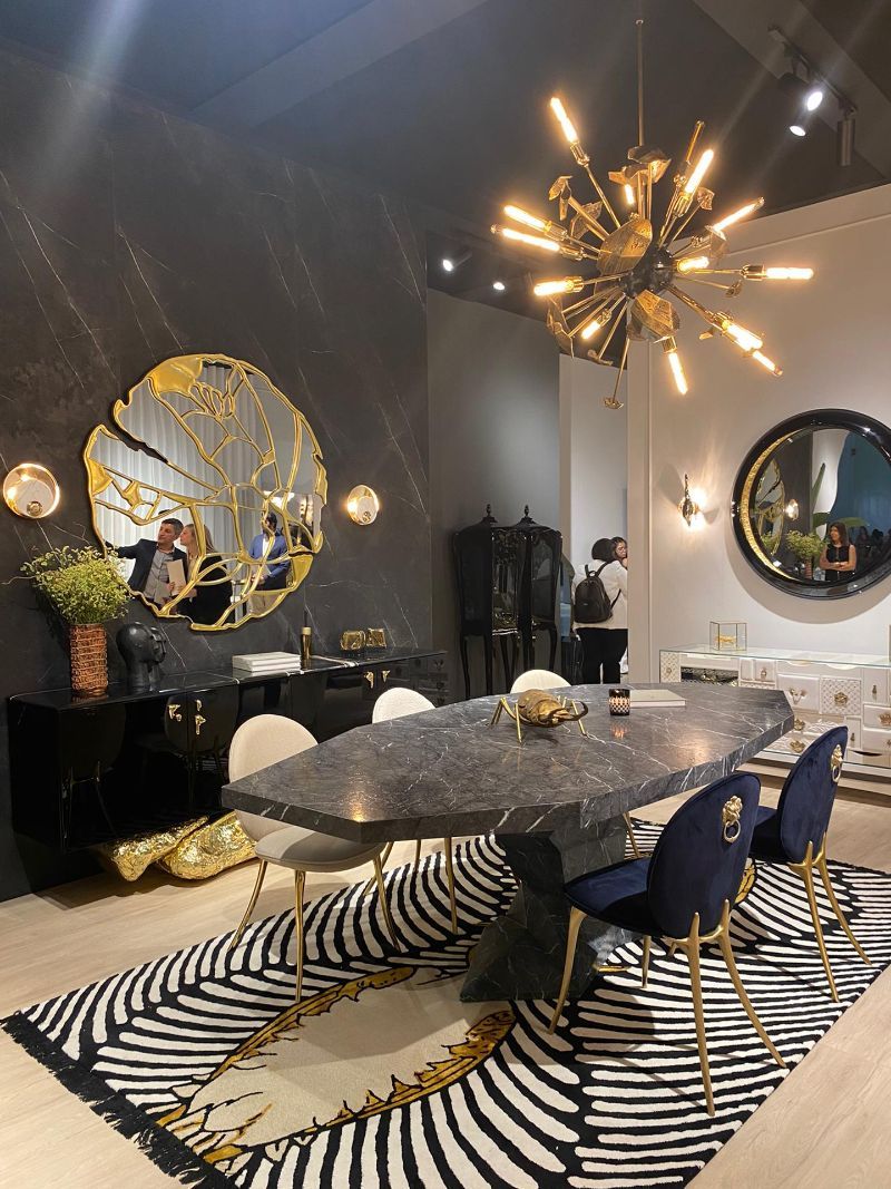 iSaloni 2022: A Practical Guide For The Fair. Dashing dining room with moodern contemporary modern rug with a couple of birds as design, marbled table and luxurious dining chairs.