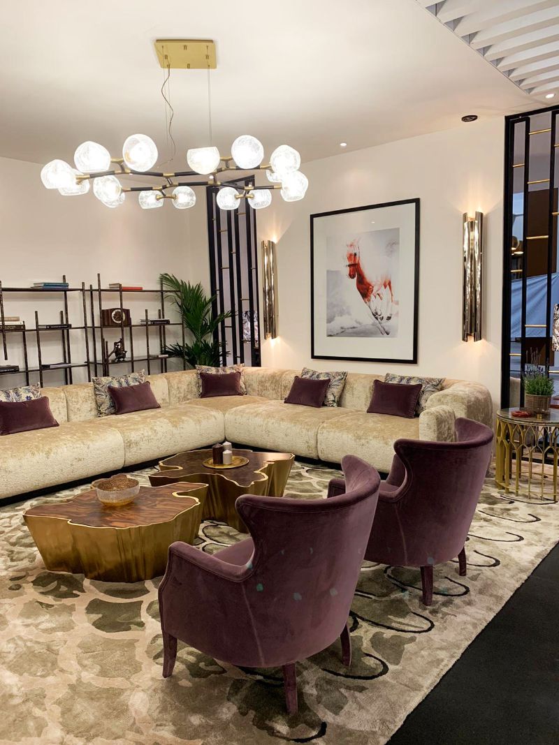 isaloni 2022: Brbabu's stand at salone del mobile with neutral area rug and contemporary modern chairs in a living room.