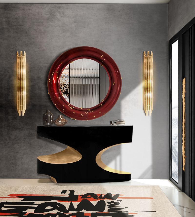 Rug Trends To Look Out For In 2023. Modern contemporary hallway with black, gold and red features. The rug pairs nicely with the round red mirror.