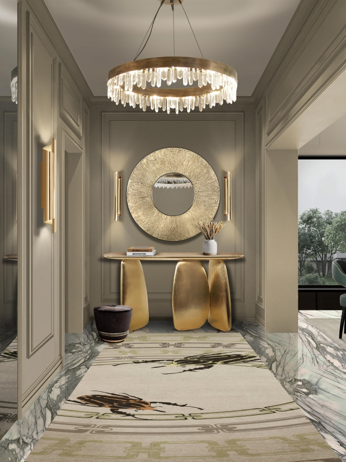 A sophisticated luxury hallway featuring a gold Ardara Console Table against a neutral wall. On the floor, a Golden Bugs II hand-tufted silk runner rug showcases 2026 rug trends including nature-mimicking textures, 3D relief effects, and earthy gold palettes. The scene blends organic shapes with high-end metallic finishes for a modern, enchanting interior design.
