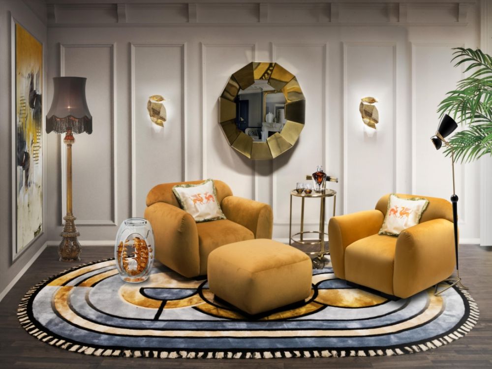 20 Clever Ways to Decorate Your Living Room with Modern Wool Rugs Modern mid-century living room with the Kleopatra Rug, oval shaped rug with blue and orange colros. Orange armchairs and golden mirror.