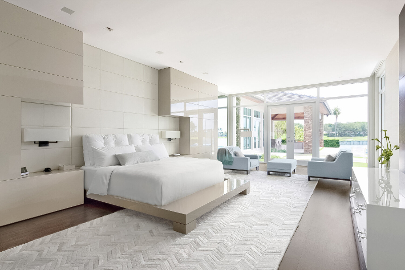 Michael Wolk - Boca Raton Residence. Bedroom in clear tones with a white rug.