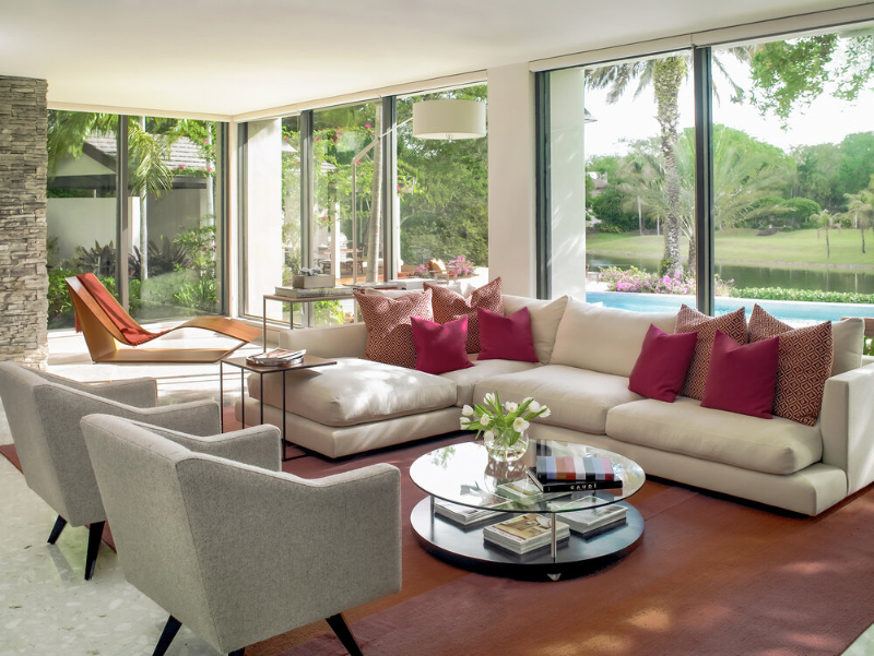 Michael Wolk - Boca Raton Residence. Living room with neutral tones combined with a peach colored rug.