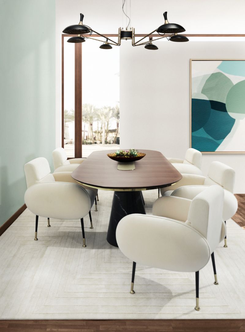 Modern contemporary dining room decorated wih white garden rug, a comfy white chairs and dining table