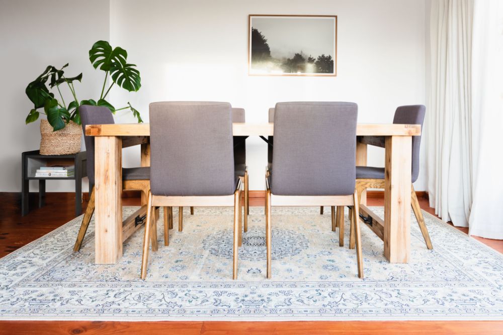 Dining room with blue area rug
