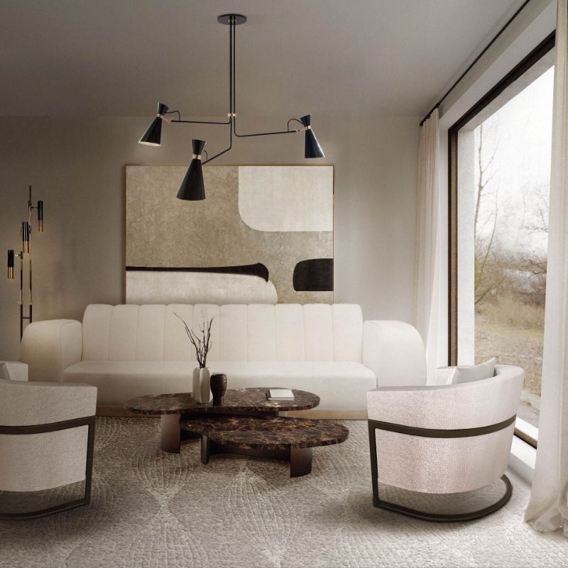 Modern living room with area rug and white sofa. Center table with white sofas, black suspension lights.