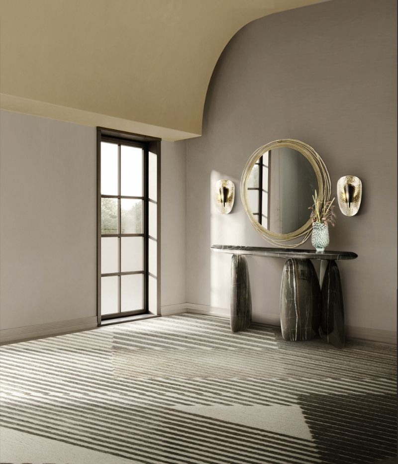 minimalist hallway with the gray AIR RUG, stylish marbled console and round golden mirror. Minimalist Rugs: The Latest Interior Trends