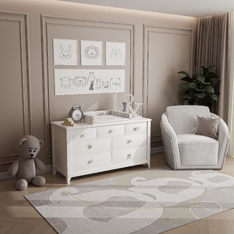 Kid's bedroom with a neutral gray rug with elephants