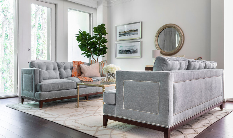 Rug Design Ideas From Pamela Hope Designs. A living room with two gray sofas on a large rug.