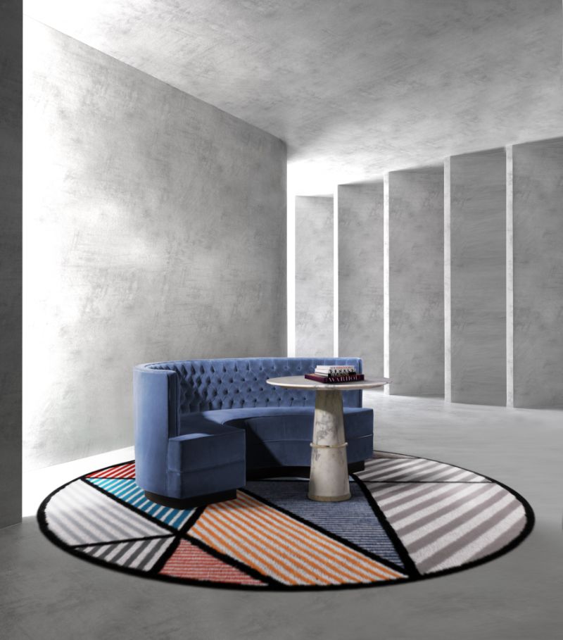 rug ideas with colorful round rug in different vibrant colors and blue sofa.