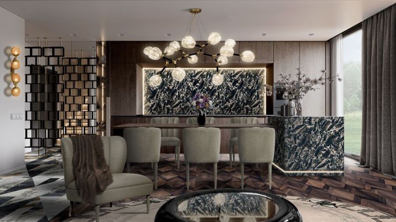 This is an unusual dining space with dark neutral tones and where the strong suspension light mixes wonderfully with the circular black center table. The METAMORPHOSIS RUG adds some charm to this space to create a contemporary decor, ideal for meeting with friends and family under the relaxing light of a suspension light and soft texture of the rug. luxurious interior design